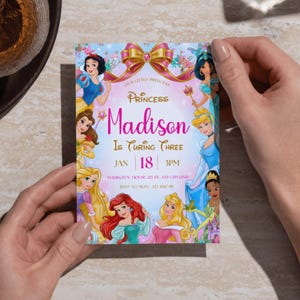 May include: A colorful invitation featuring Disney princesses, with the text "Princess Madison Is Turning Three." The invitation includes the date, time, and RSVP information. The design incorporates a pink and gold bow and floral accents.