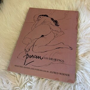 May include: A book titled "Posen 110 Drawings" with a nude figure drawing on the cover. The book is selected, edited, and introduced by Alfred Werner.