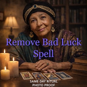 May include: An older woman wearing a turban and jewelry smiles in front of a bookshelf. The text "Remove Bad Luck Spell" is displayed in purple. Tarot cards and lit candles are on the table. The text "SAME DAY RITUAL PHOTO PROOF" is at the bottom.