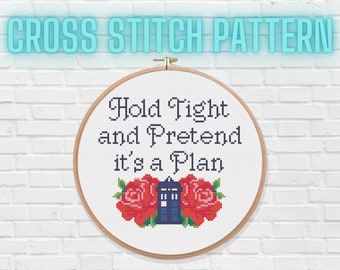 May include: Cross stitch pattern in a wooden hoop with the text "Hold Tight and Pretend it's a Plan" and a blue police box with two red roses on either side.