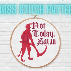 May include: Cross stitch pattern featuring a red silhouette of a devil holding a scythe with the text "Not Today, Satan" in a gothic font.