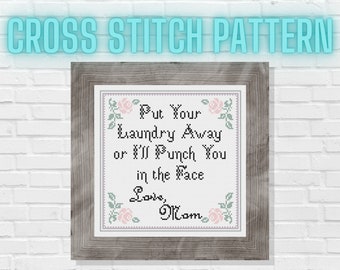 May include: Cross stitch pattern with a humorous message: "Put your laundry away or I'll punch you in the face. Love, Mom." The pattern features pink and green roses.