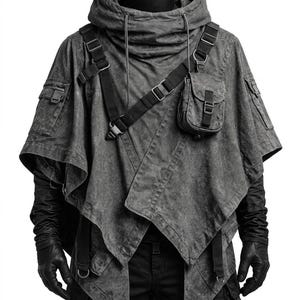May include: A charcoal gray hooded poncho featuring a layered asymmetrical hem, multiple utility pockets, and black adjustable webbing straps with metal buckles. The garment includes a high collar with drawstrings and is worn over black gloves.