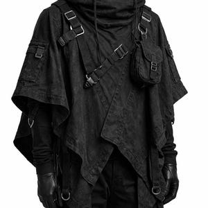 May include: A black hooded poncho featuring multiple utility pockets, adjustable straps with metal buckles, and a layered asymmetrical hem. The garment includes a detachable small pouch on the chest, side cargo pockets, and integrated D-ring hardware.