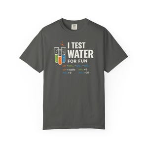 May include: Dark gray t-shirt with the text "I TEST WATER FOR FUN" in white. The shirt features three colorful test tubes and chemical formulas. A fun and educational design for science enthusiasts.