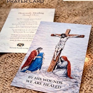May include: A Good Friday prayer card featuring an illustration of the crucifixion of Jesus with two figures kneeling at the base of the wooden cross. The text reads BY HIS WOUNDS WE ARE HEALED. A second card shows the title Heavenly Healing Through Christ.