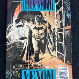 May include: Batman comic book, Legends of the Dark Knight, No. 16, featuring Batman holding a lantern in a dark, rainy setting. The cover has the text "VENOM PART ONE OF FIVE" and the DC Comics logo.