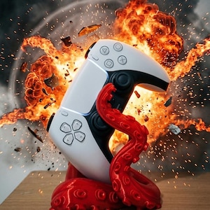 Peut inclure: Une manette de jeu blanche et noire sur un support rouge en forme de pieuvre. La manette présente des symboles de boutons. Le support a une surface texturée et détaillée. L'arrière-plan montre une explosion.
