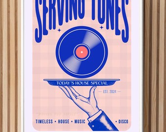 May include: A framed poster with the text "SERVING TUNES" in blue, featuring a blue vinyl record on a tray held by a hand. The poster includes the text "TODAY'S HOUSE SPECIAL - EST. 2024" and the words "TIMELESS • HOUSE • MUSIC • DISCO".