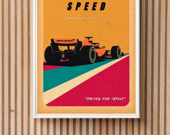 May include: A framed poster with a retro design featuring an orange and black Formula 1 race car. The poster has the text "BUILT FOR SPEED" and "DRIVEN FOR IMPACT". The McLaren Formula 1 Team logo is also visible.