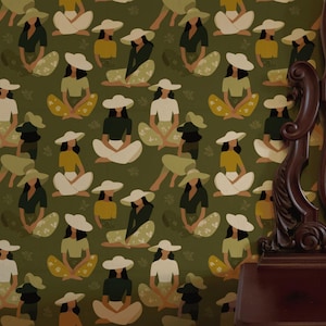 May include: Olive green wallpaper featuring a repeating pattern of figures in hats, seated with legs crossed. The figures are depicted in various colors, including white, yellow, and black. A dark brown, ornate mirror frame is visible on the right side.