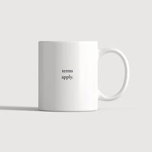 May include: A white ceramic mug featuring the black text "terms apply." printed in a simple serif font on the front. The mug has a smooth, cylindrical body and a curved handle on the right side, maintaining a clean and minimalist appearance.