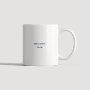 May include: A white ceramic mug with a handle on the right side. The front of the mug features the text "ansonsten nope." printed in a dark blue, sans-serif font centered on the surface of the mug against the plain white background.