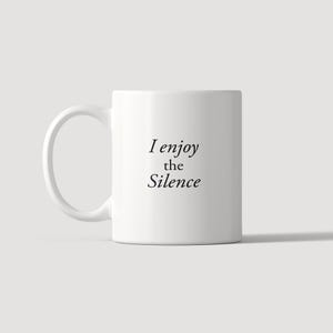May include: A white ceramic mug with a curved handle featuring the black printed text I enjoy the Silence centred on the front. The mug has a smooth, cylindrical body and a clean, minimalist design suitable for holding hot or cold beverages.