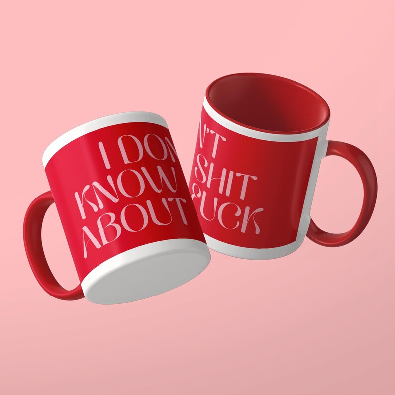 May include: Two red ceramic mugs with white interiors and handles. The left mug features the white text I DON'T KNOW ABOUT. The right mug features the white text I DON'T KNOW ABOUT SHIT FUCK. Both mugs have a smooth finish and a cylindrical shape.