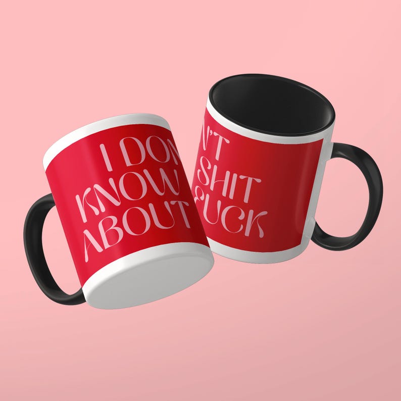 May include: Two ceramic mugs with a bright red exterior and a solid black interior and handle. The mugs feature white text that reads I DON'T KNOW ABOUT SHIT FUCK in a stylized serif font. The design wraps around the exterior of the mugs.