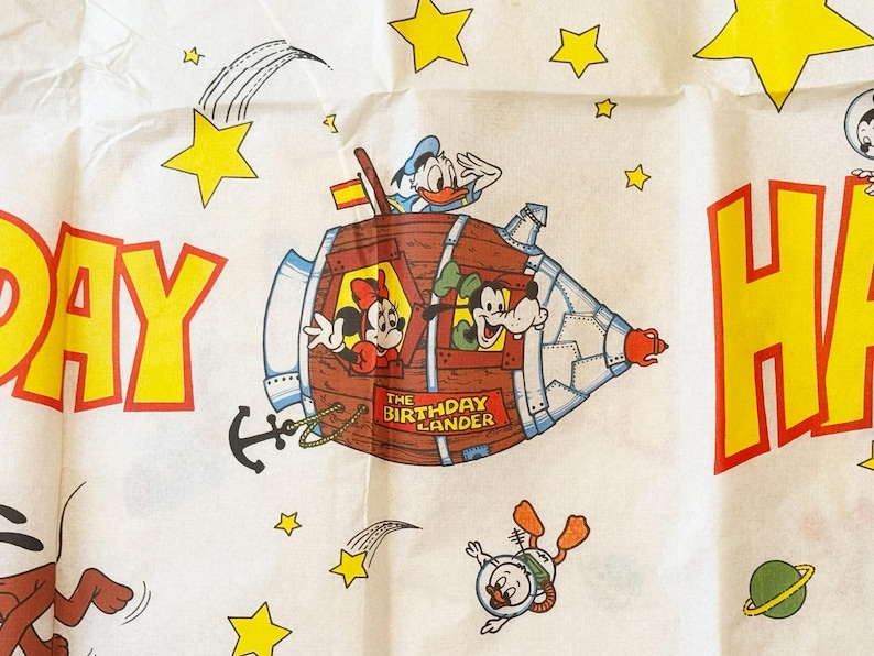 May include: A white ceramic mug with a black handle and the text "But First, Coffee" in a black, bold font. The mug is sitting on a white surface. The mug is a standard size.