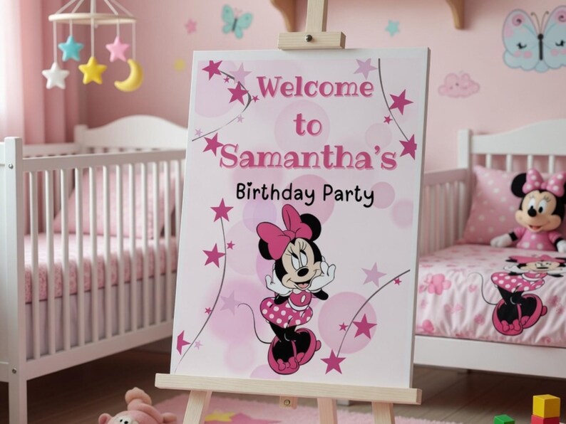 May include: A pink and white sign on an easel reads "Welcome to Samantha's Birthday Party" with a Minnie Mouse graphic. The sign is in a pink room with a crib and Minnie Mouse bedding.