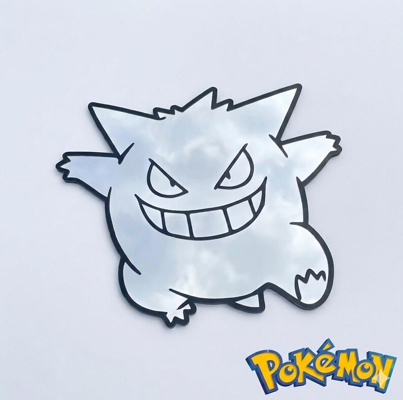 May include: A mirror in the shape of a Gengar, a Pok&eacute;mon character, with a black outline. The mirror reflects the sky and clouds. The Pok&eacute;mon logo is in the bottom right corner.