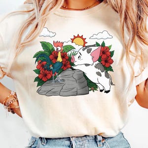 May include: A set of three ceramic mugs with a speckled, matte finish. The mugs are in shades of cream, light gray, and dark gray. Each mug has a simple, minimalist design and a rounded handle.