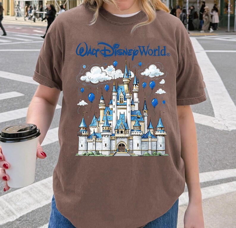 May include: A white ceramic mug with a black handle and the text "But First, Coffee" in a bold, black font. The mug is set against a neutral background, highlighting its simple design. The mug is approximately 4 inches tall.