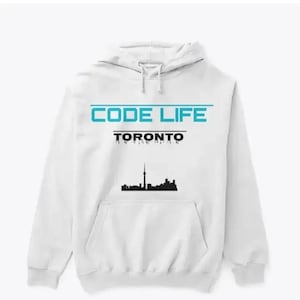 May include: White hooded sweatshirt with a front pocket. The sweatshirt features the text "CODE LIFE" in blue, with "TORONTO" below it in black. A black silhouette of the Toronto skyline is also visible.