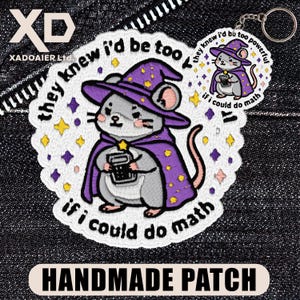 May include: Embroidered patch with a cartoon mouse wearing a purple wizard hat and cape, holding a calculator. Text: "they knew I'd be too powerful if I could do math." Includes a keychain version. The patch is labelled "HANDMADE PATCH."