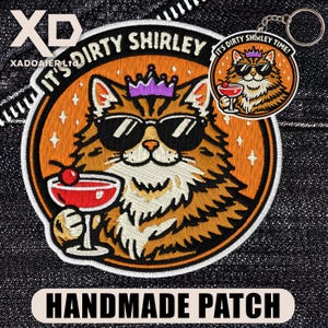 May include: Embroidered patch and keychain featuring a cat wearing sunglasses and a crown, holding a cocktail. The patch reads "IT'S DIRTY SHIRLEY" and "HANDMADE PATCH". The keychain says "IT'S DIRTY SHIRLEY TIME!"