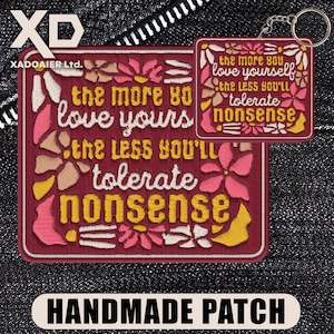 May include: Embroidered patch and keychain set with the text "the more you love yourself, the less you'll tolerate nonsense." The patch and keychain are burgundy with floral accents in pink, yellow, and cream. The keychain has a metal ring.
