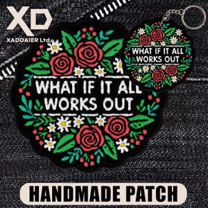 May include: Black embroidered patch and keychain set with the text "WHAT IF IT ALL WORKS OUT". The patch and keychain are decorated with red roses, white flowers, and green leaves. The bottom of the image reads "HANDMADE PATCH".