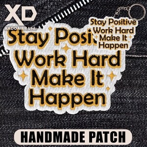 May include: Embroidered patch with the text "Stay Positive Work Hard Make It Happen" in black and yellow. The patch is white with a decorative border and a keychain attachment. The words "HANDMADE PATCH" are at the bottom.