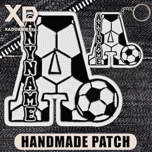 May include: Black and white embroidered patches and keychain with a football design. The patches and keychain feature the letter "A" and the text "ANYNAME". The bottom patch reads "HANDMADE PATCH".