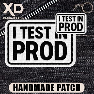 May include: A white ceramic mug with a black handle and the text "But First, Coffee" in a bold, black font. The mug is set against a blurred background, suggesting a cozy setting.