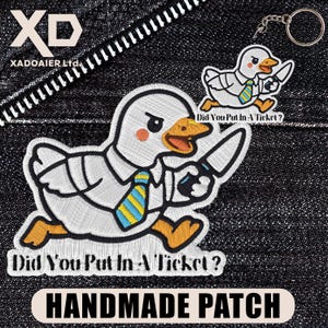May include: Embroidered patch featuring a cartoon duck in a white shirt and blue and yellow striped tie, holding a knife. The text "Did You Put In A Ticket?" is below the duck. A keychain with a similar design is also visible. The words "HANDMADE PATCH" are at the bottom.