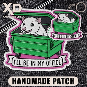 May include: Embroidered patch and keychain featuring a white opossum in a green dumpster. The patch and keychain have the text "I'LL BE IN MY OFFICE" on a banner. The patch also has the text "HANDMADE PATCH".