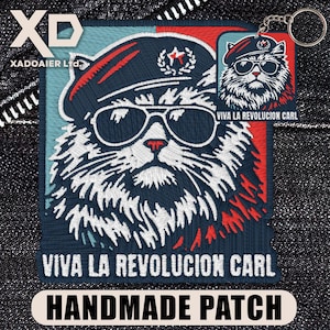 May include: Embroidered patch featuring a cat wearing sunglasses and a beret, with the text "VIVA LA REVOLUCION CARL." A smaller keychain with the same design is also visible. The patch is labeled "HANDMADE PATCH."