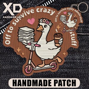May include: Embroidered patch with a white goose on a pink scooter, holding papers and a coffee cup. Text reads "Off to survive crazy admin stuff" and "Handmade Patch". The patch is brown with pink and white details.