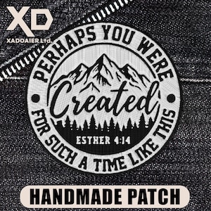 May include: A circular embroidered patch featuring a black and white mountain landscape with a forest silhouette. The text reads: PERHAPS YOU WERE Created FOR SUCH A TIME LIKE THIS and ESTHER 4:14. The design is stitched in white thread on black.