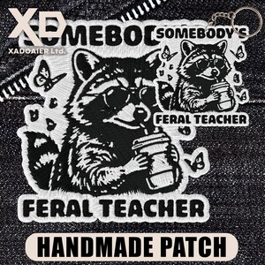 May include: Embroidered patch with a raccoon design, wearing sunglasses and holding a coffee cup. The patch reads "FERAL TEACHER" and "HANDMADE PATCH". The design includes butterflies and the text "SOMEBODY'S".