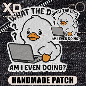 May include: Embroidered patch featuring a white duck with a laptop, the text "WHAT THE DUCK?" and "AM I EVEN DOING?" is included. The patch is labeled "HANDMADE PATCH". The design includes question marks and a small keychain.