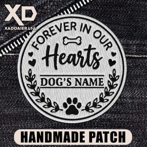 May include: Embroidered patch with the text "FOREVER IN OUR HEARTS" and "DOG'S NAME" in black script. The design includes a bone, hearts, paw prints, and leaves. The bottom banner reads "HANDMADE PATCH".