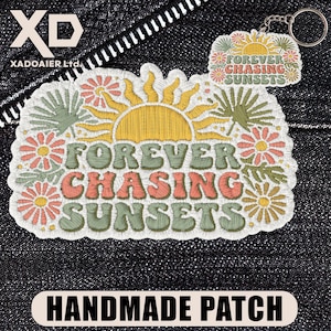 May include: Embroidered patch and keychain set with a sunset and floral design. The patch and keychain feature the text "FOREVER CHASING SUNSETS" in orange and green. The patch is surrounded by a white border and the keychain has a silver ring.
