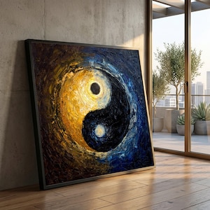 May include: A square canvas painting in a black frame featuring a textured impasto yin and yang symbol. The left side is rendered in vibrant shades of yellow and gold, while the right side is composed of deep navy blue and black tones.