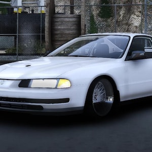 Op de afbeelding: Een witte coupé met een strak design. De auto heeft een laag profiel, getinte ramen en aangepaste velgen. De koplampen zijn geel. De auto staat op een donkere ondergrond.
