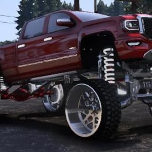 May include: A lifted red GMC truck with large chrome wheels and tires. The truck has a custom suspension and is parked on asphalt. The GMC logo is visible on the front grille.