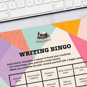 May include: A Writing Bingo game sheet featuring a geometric background in shades of pink, purple, orange, and teal with gold polka dots. The text reads Writing Bingo, instructions, and various writing prompts within a black grid, plus a typewriter logo.