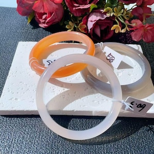 May include: A set of three ceramic mugs with a speckled, matte finish in cream, light grey, and dark grey. Each mug has a minimalist design and a rounded handle. Suitable for coffee, tea, or other beverages. Metric measurements apply.