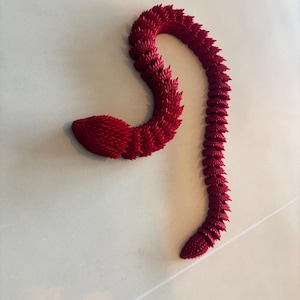 May include: A trio of ceramic mugs with a speckled, matte finish in cream, light grey, and dark grey. Each mug features a simple, minimalist design, ideal for tea or coffee.