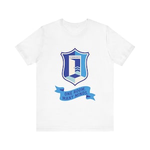 May include: White t-shirt featuring a blue and white crest design with the word "COMMANDS" at the top. Below the crest is a blue banner with the text "ONE ROOM. MANY MINDS."