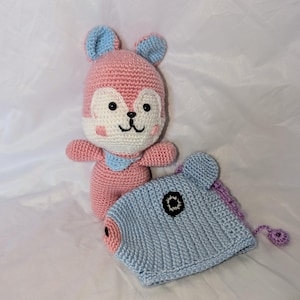 May include: A set of three ceramic mugs with a speckled, matte finish. The mugs are in shades of cream, light gray, and dark gray. Each mug has a simple, minimalist design and a rounded handle.